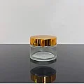 50 ml Şeffaf Cam Krem Kavanozu Parlak Gold Kapaklı Tıpalı 50 ml Şeffaf Cam Krem Kavanozu Parlak Gold Kapaklı Tıpalı