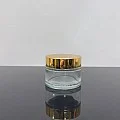 50 ml Şeffaf Cam Krem Kavanozu Parlak Gold Kapaklı Tıpalı 50 ml Şeffaf Cam Krem Kavanozu Parlak Gold Kapaklı Tıpalı